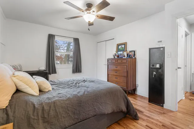 a bedroom with a bed and a dresser