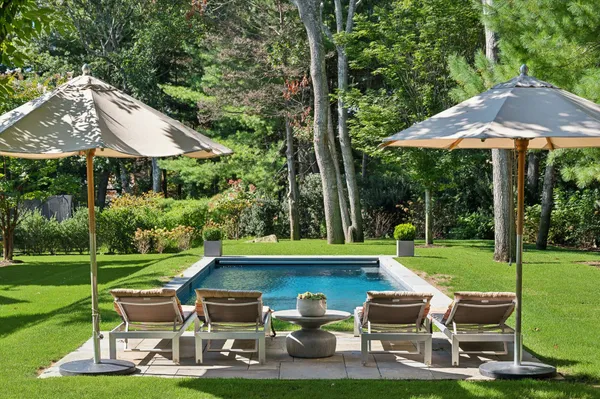 a view of a table and chairs under an umbrella