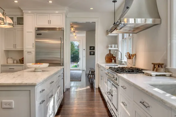 a kitchen with a sink stove and refrigerator