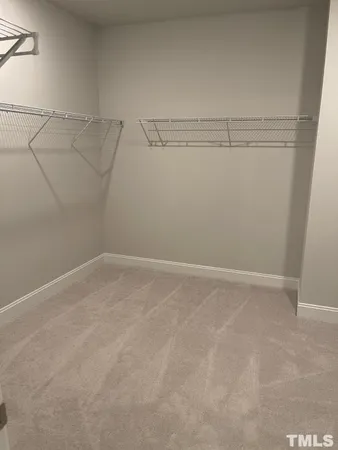 a view of a room with racks on the wall