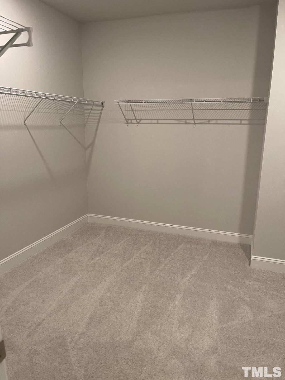 168 Edge Of Auburn Boulevard Raleigh, NC 27610 - Photo 16 of 19 a view of a room with racks on the wall