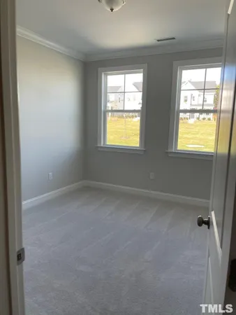 en empty room with windows