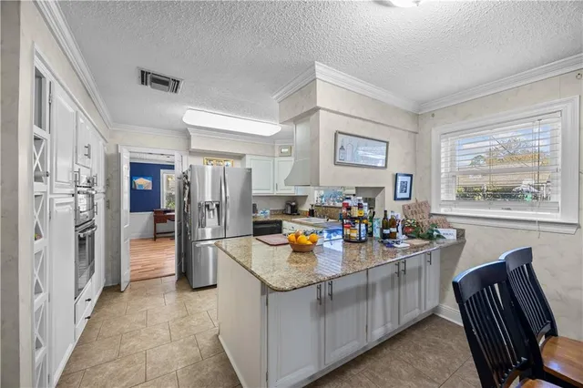 $565,000 | 9631 Wildwood Drive, River Ridge, LA 70123