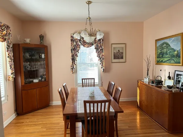 a dining room with furniture and window