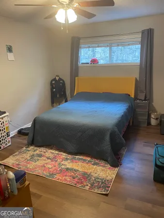 a view of walk in closet with clothes