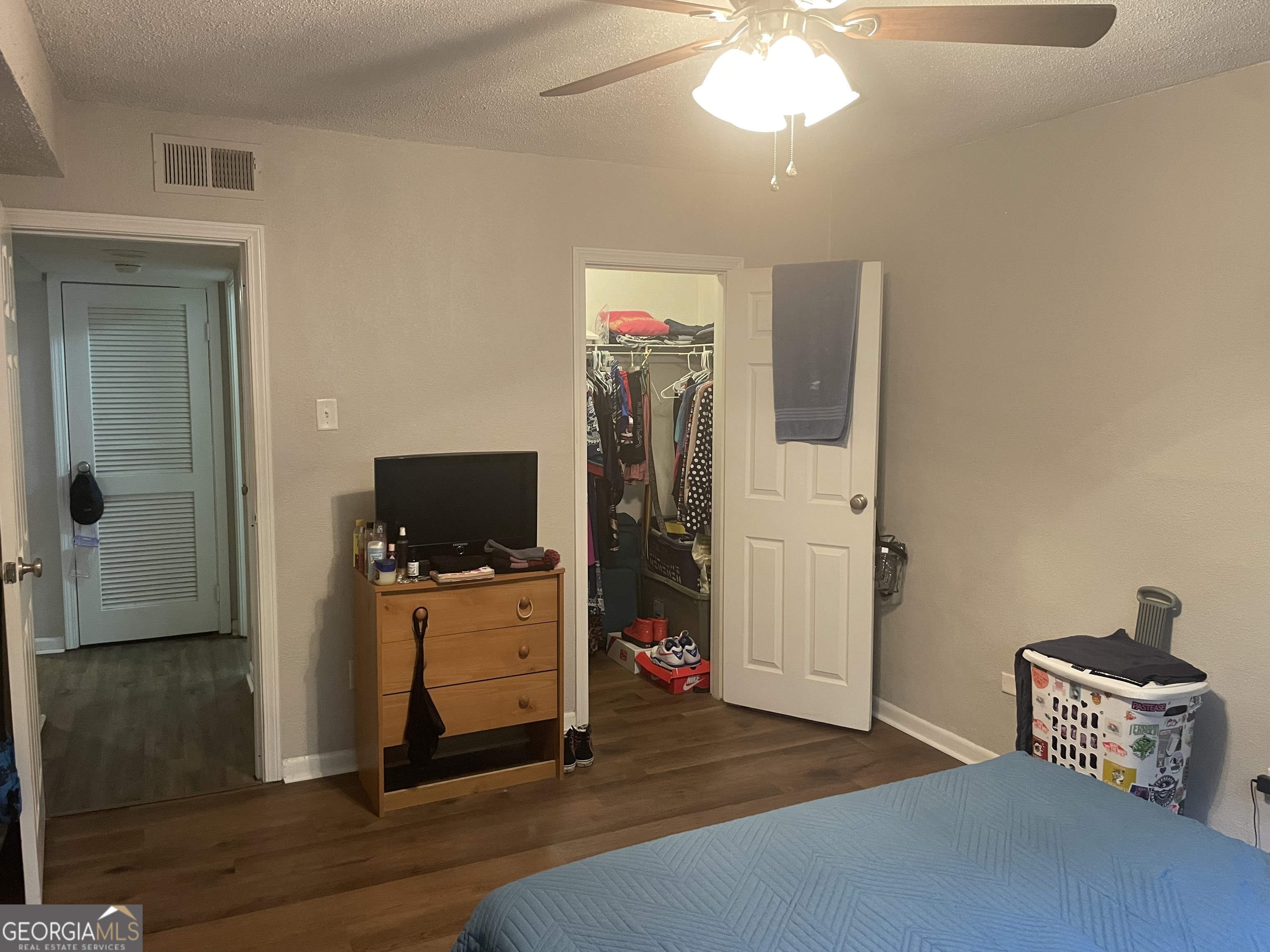 250 Little Street, Unit B102 Athens, GA 30605 - Photo 17 of 20 a living room with furniture and a mirror