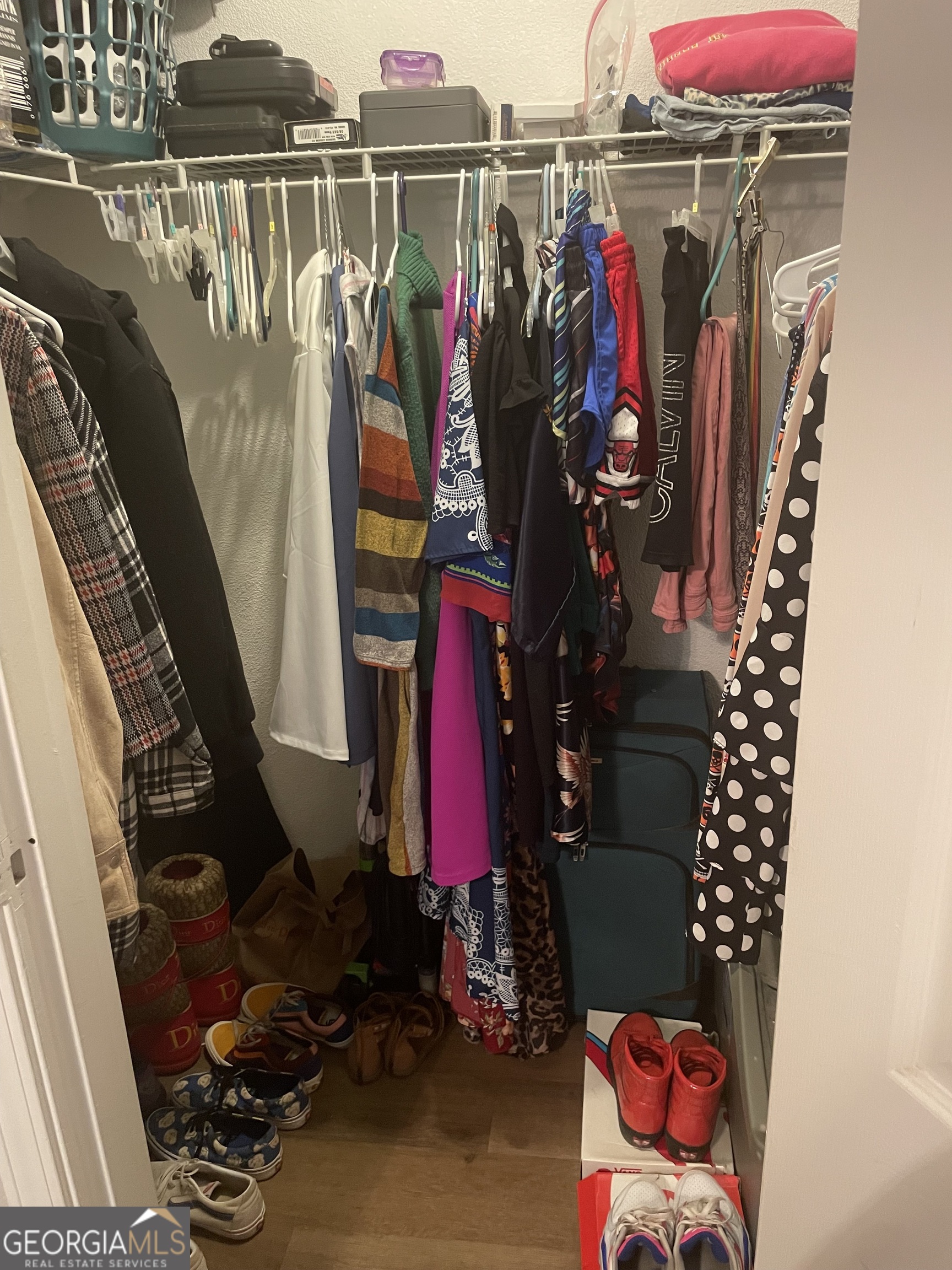 250 Little Street, Unit B102 Athens, GA 30605 - Photo 18 of 20 a view of walk in closet with clothes