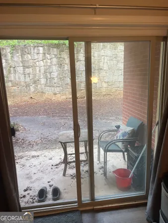 a bathroom with a granite countertop sink and a toilet