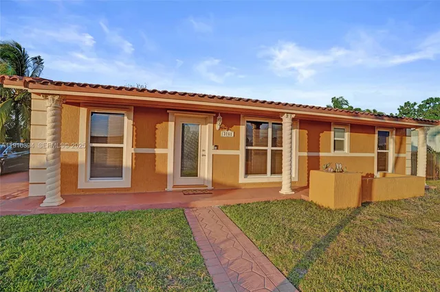 front view of a house with a yard