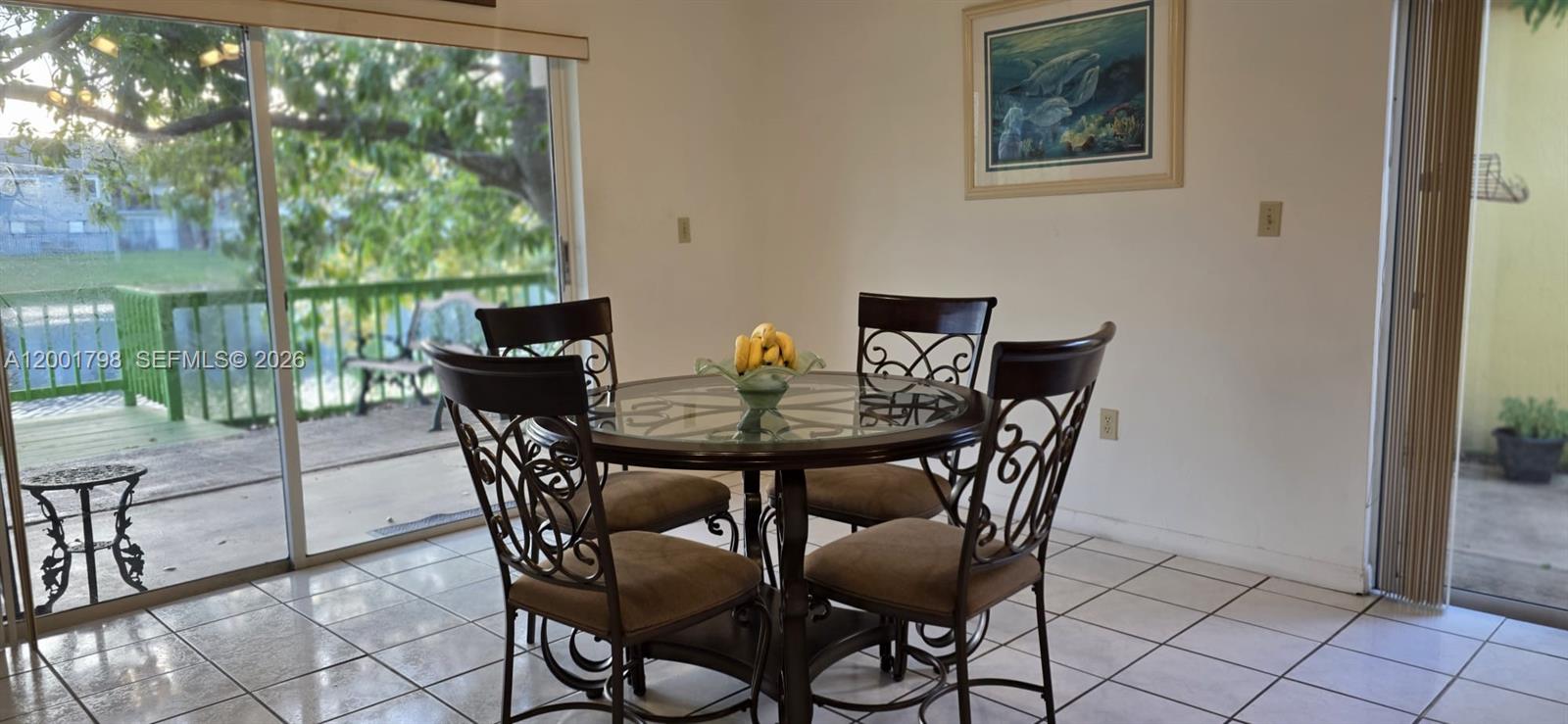 14971 Southwest 75th Terrace Miami, FL 33193 - Photo 11 of 24 a view of a dining room with furniture window and outside view