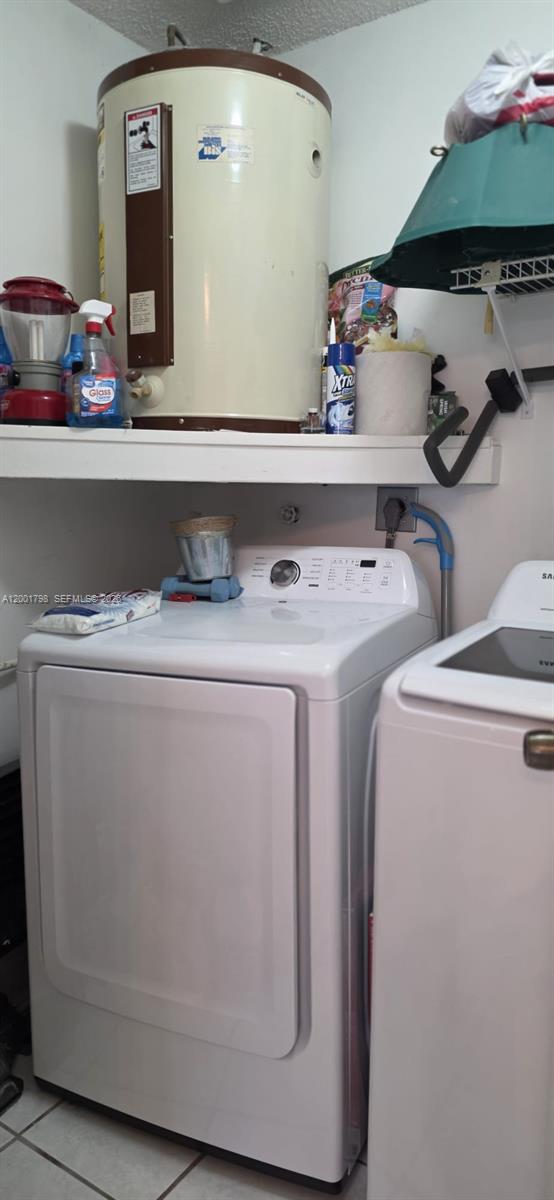 14971 Southwest 75th Terrace Miami, FL 33193 - Photo 15 of 24 a utility room with dryer and washer