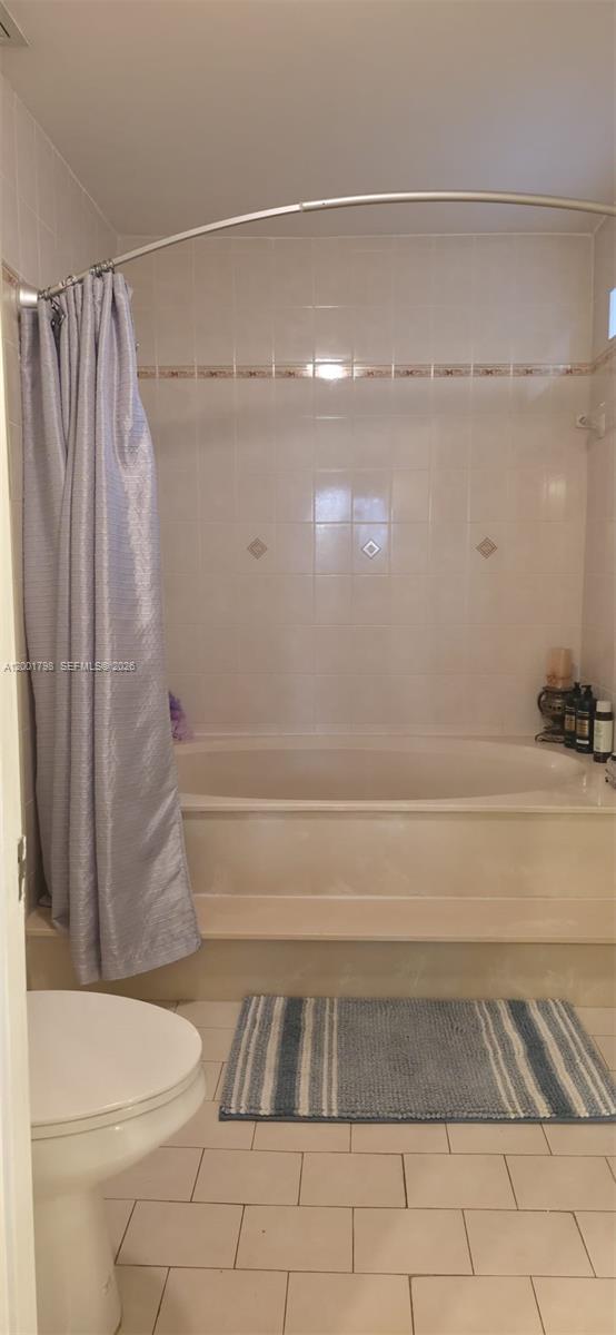 14971 Southwest 75th Terrace Miami, FL 33193 - Photo 18 of 24 a bathroom with a toilet and a shower