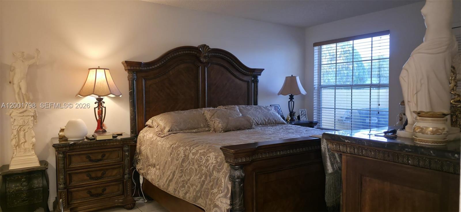 14971 Southwest 75th Terrace Miami, FL 33193 - Photo 20 of 24 a bedroom with a bed and a window