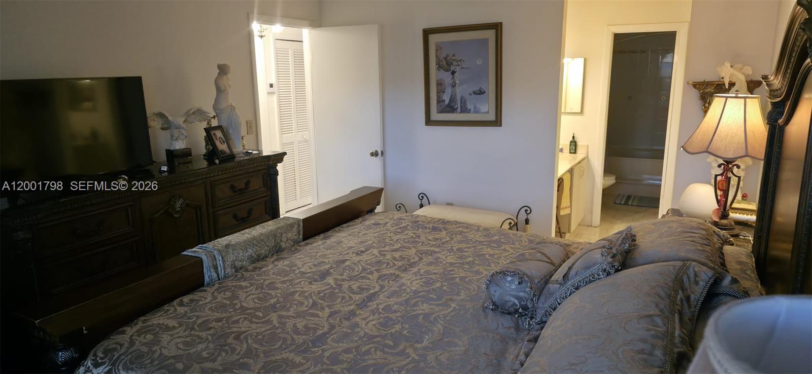 14971 Southwest 75th Terrace Miami, FL 33193 - Photo 21 of 24 a bedroom with furniture and a flat screen tv
