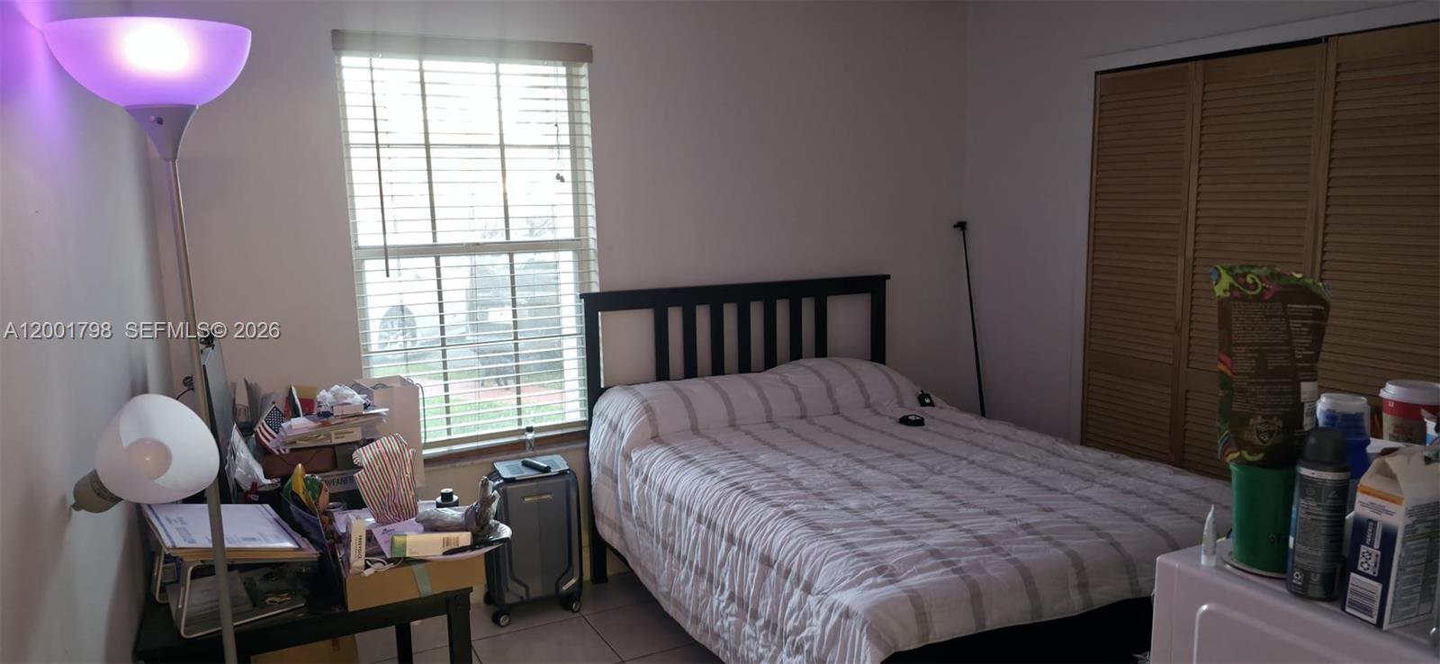 14971 Southwest 75th Terrace Miami, FL 33193 - Photo 23 of 24 a bedroom with bed and a window