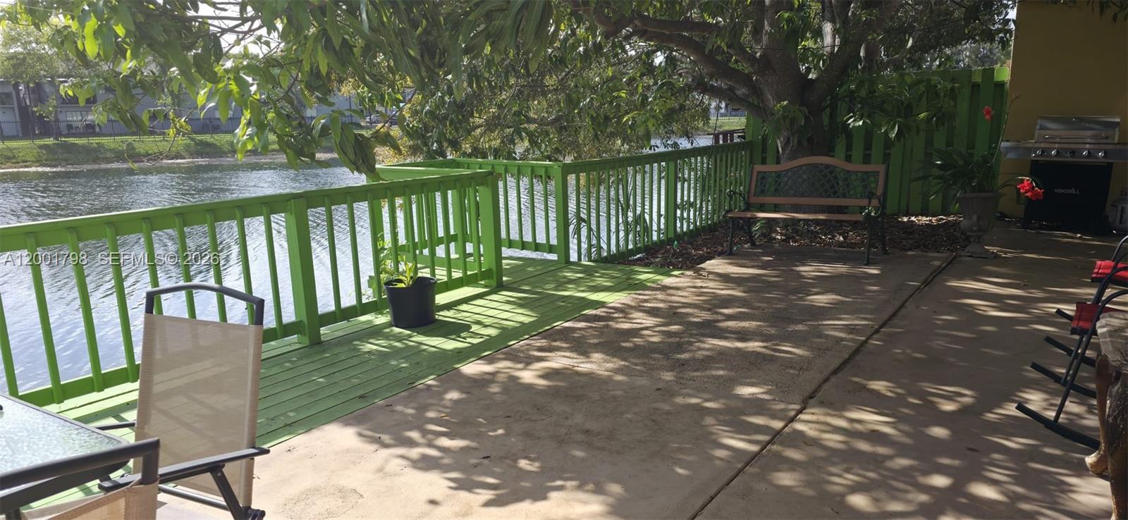 14971 Southwest 75th Terrace Miami, FL 33193 - Photo 6 of 24 a view of a street with a bench in patio