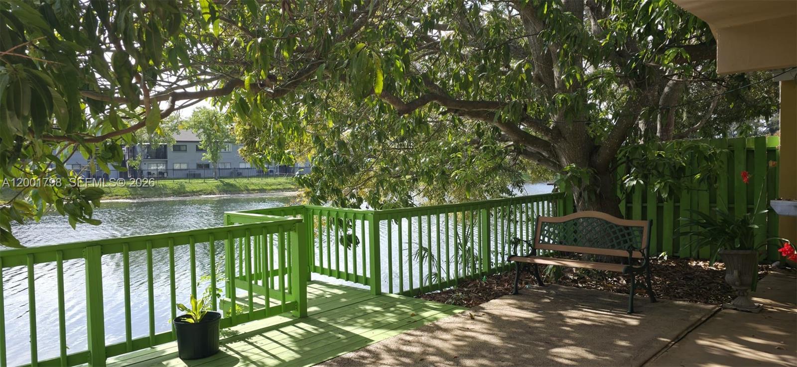 14971 Southwest 75th Terrace Miami, FL 33193 - Photo 7 of 24 a view of a bench in backyard of house