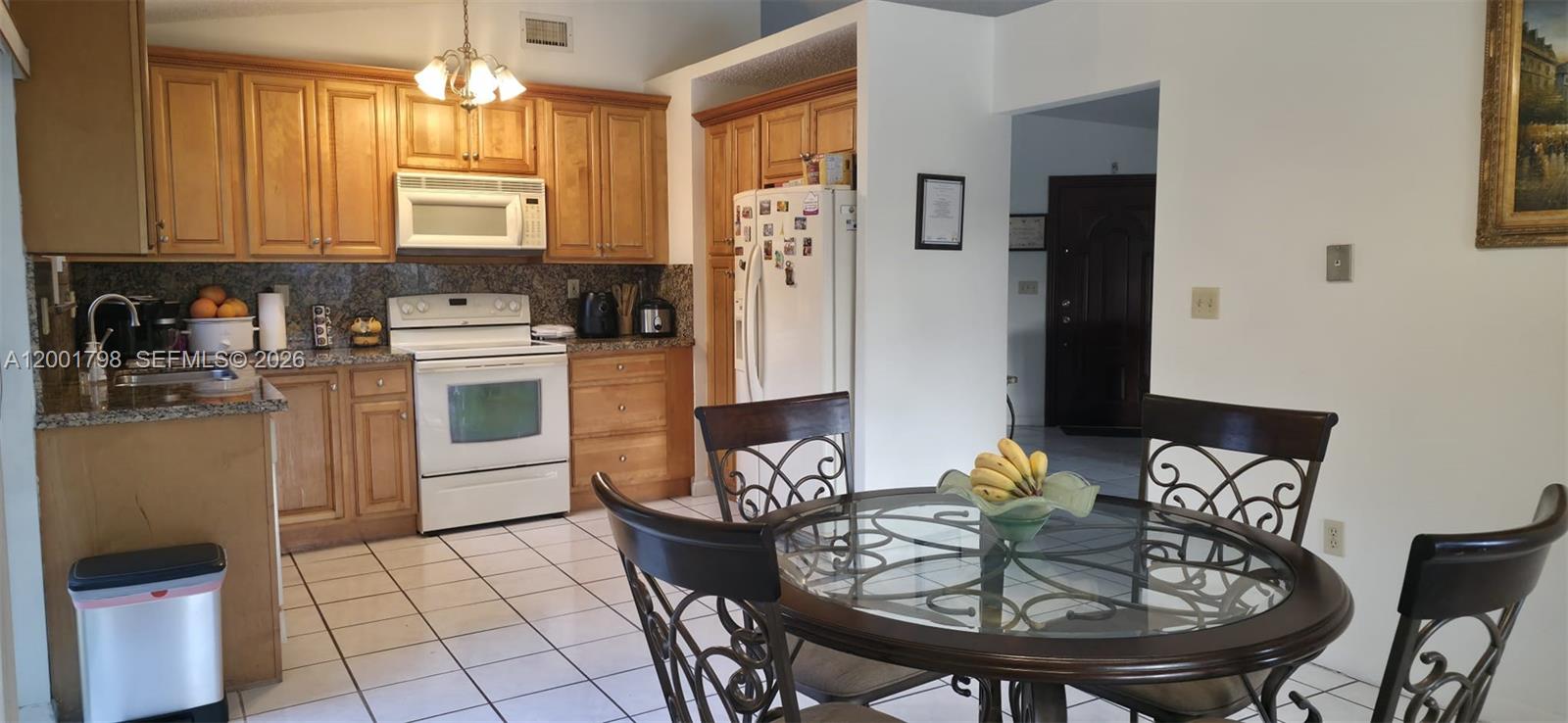 14971 Southwest 75th Terrace Miami, FL 33193 - Photo 8 of 24 a view of a dining room with furniture