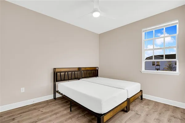 a bedroom with a bed and window