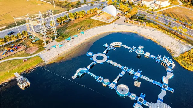 a view of a swimming pool with a table and chairs