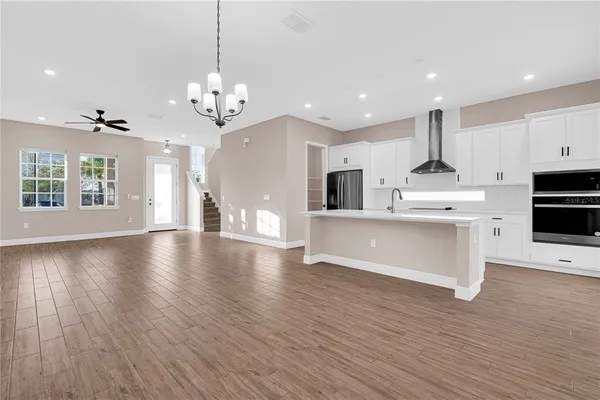 a large kitchen with stainless steel appliances kitchen island a large island in the center