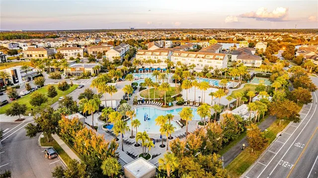 an aerial view of residential house with outdoor space and swimming pool