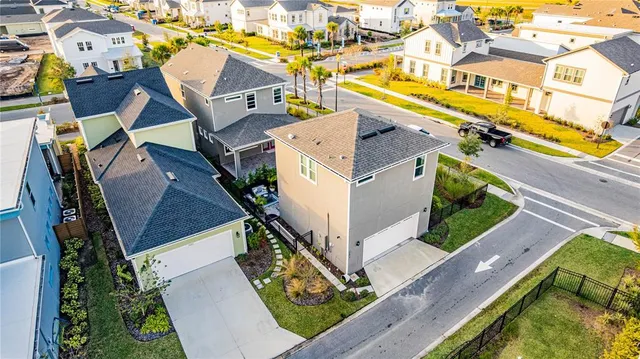 an aerial view of a house with a swimming pool