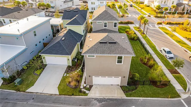 an aerial view of a house with a swimming pool