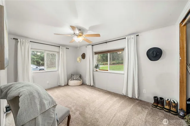 a bed room with a bed and a window