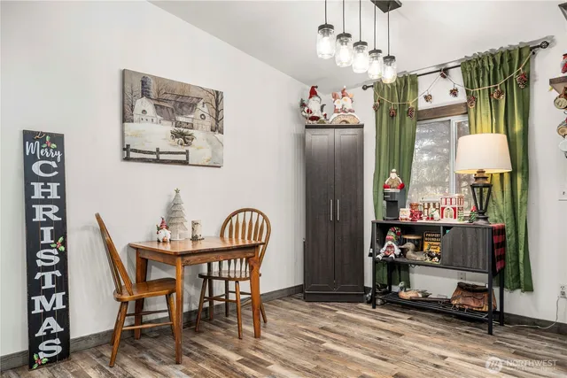 a dining room with furniture and window