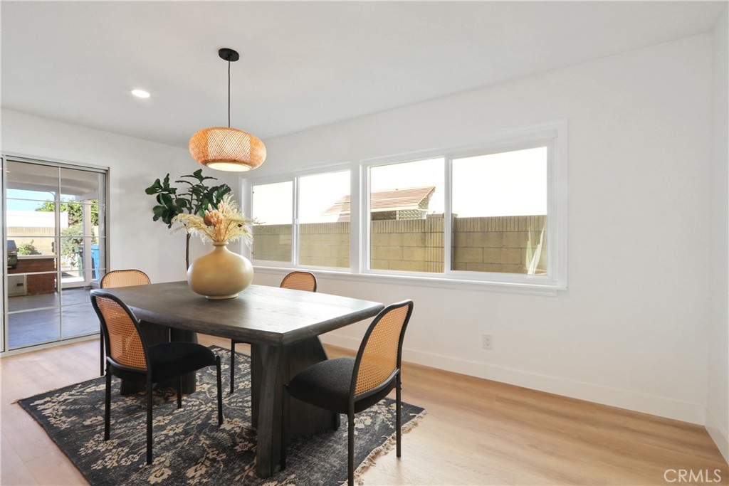5633 Lakia Drive Cypress, CA 90630 - Photo 11 of 25 a view of a dining room with furniture window and wooden floor