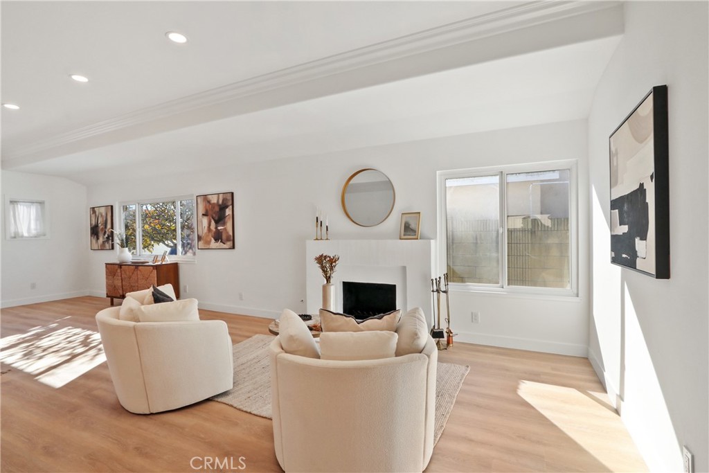 5633 Lakia Drive Cypress, CA 90630 - Photo 6 of 25 a living room with furniture and a fireplace