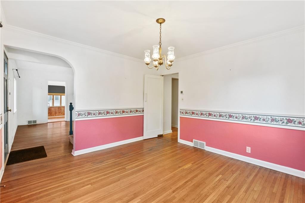 306 Washington Road Pittsburgh, PA 15221 - Photo 14 of 40 Hardwood floors are continuous throughout the main level.