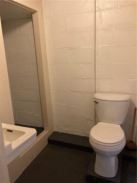 306 Washington Road Pittsburgh, PA 15221 - Photo 32 of 40 Half bath just off the basement workroom.