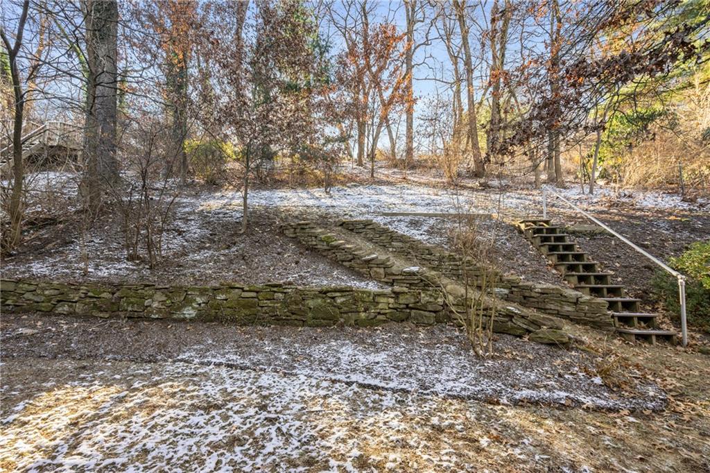306 Washington Road Pittsburgh, PA 15221 - Photo 7 of 40 Beautiful stone walls in the rear yard are pleasing to the sight.