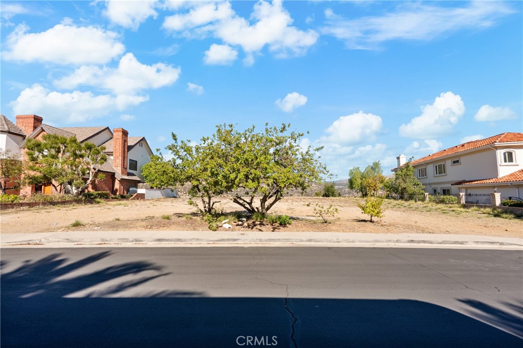 22451 South Summit Ridge Circle Chatsworth, CA 91311 - Photo 1 of 19 a view of a street