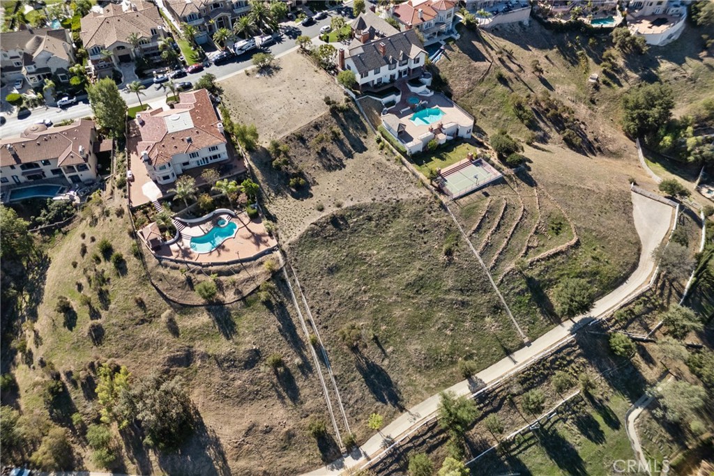 22451 South Summit Ridge Circle Chatsworth, CA 91311 - Photo 12 of 19 view of a house with a yard