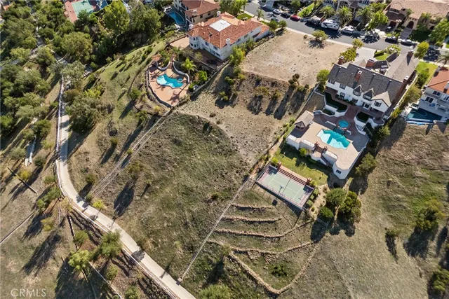 an aerial view of houses with outdoor space