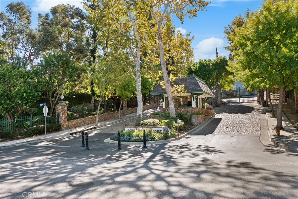 22451 South Summit Ridge Circle Chatsworth, CA 91311 - Photo 18 of 19 a view of a bench in a backyard