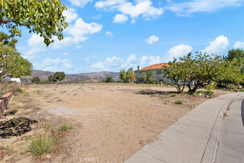 22451 South Summit Ridge Circle Chatsworth, CA 91311 - Photo 2 of 19 a view of a dirt yard