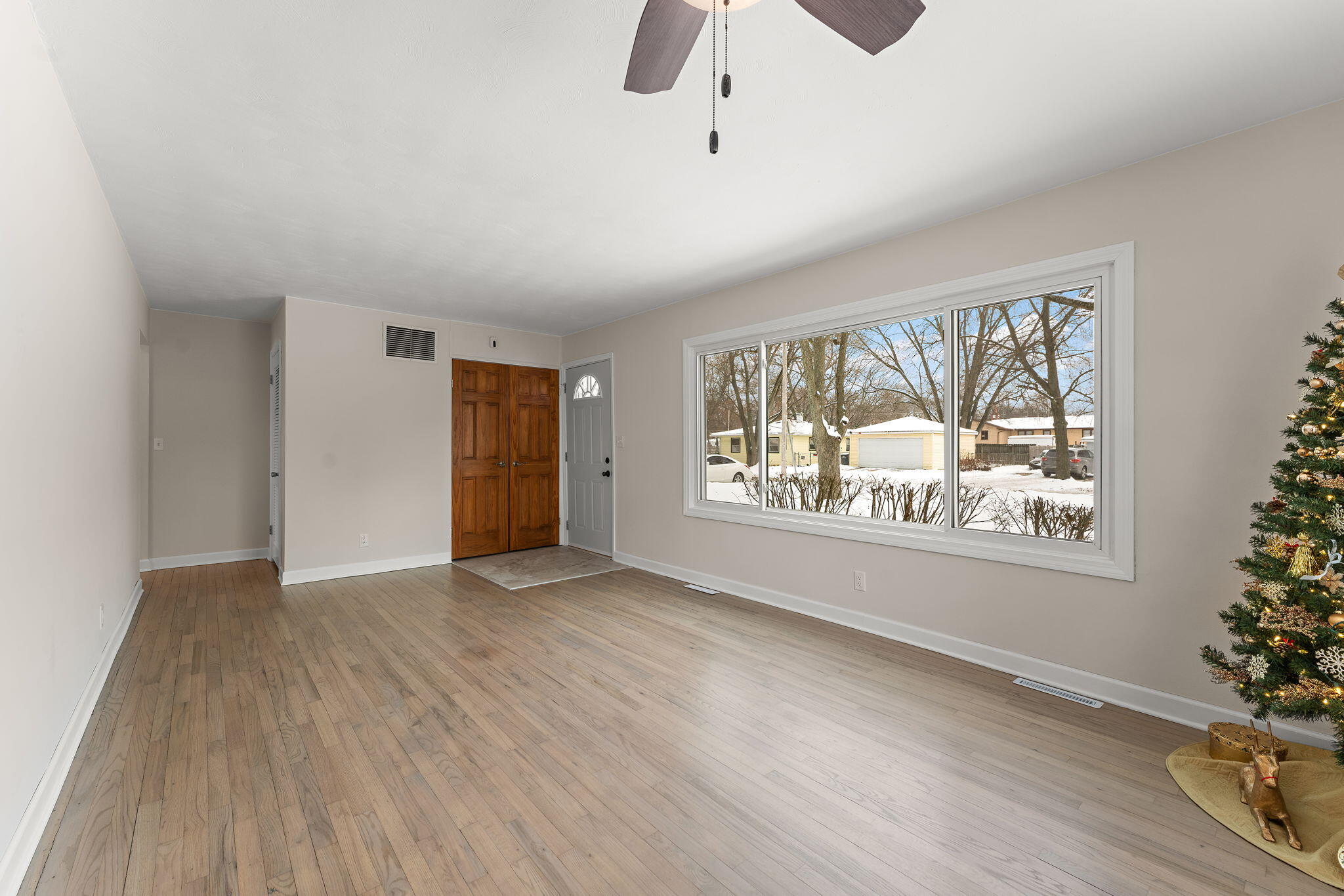 2782 Eleanor Street Portage, IN 46368 - Photo 6 of 20 wooden floor in an empty room with a window