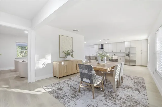 a dining room with furniture and window