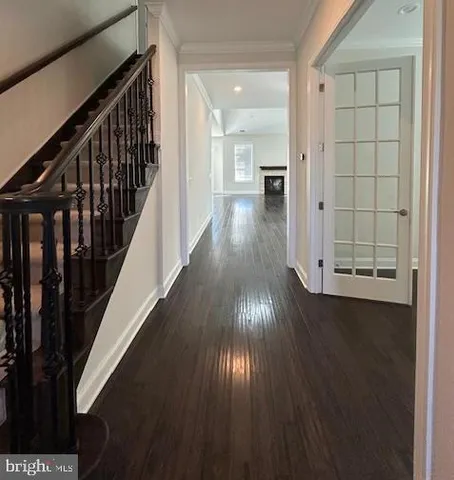 a view of gallery with wooden floor