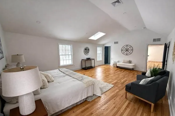 a bedroom with a bed and window