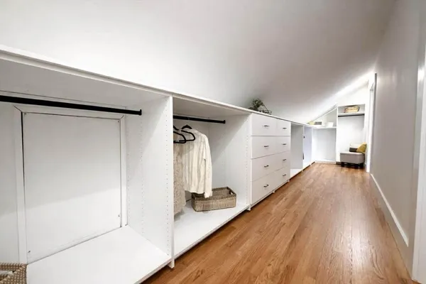 a view of a hallway with white walls