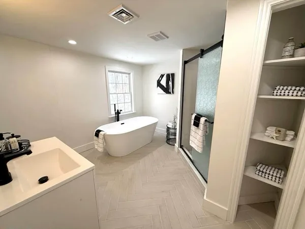 a bathroom with a sink and mirror
