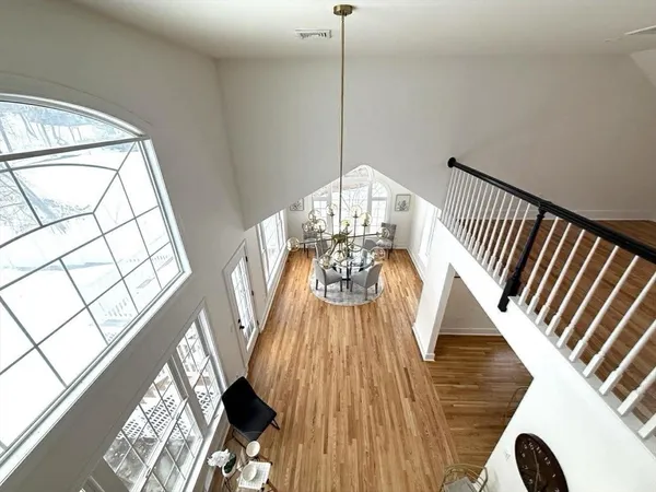 a view of balcony with wooden floor