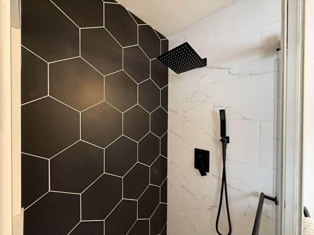 576 Grove Street Framingham, MA 01701 - Photo 26 of 38 a bathroom with a shower