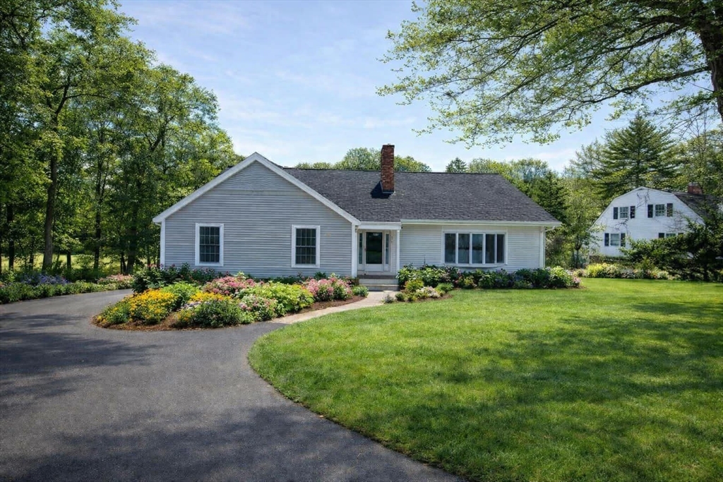 576 Grove Street Framingham, MA 01701 - Photo 3 of 38 a front view of a house with garden