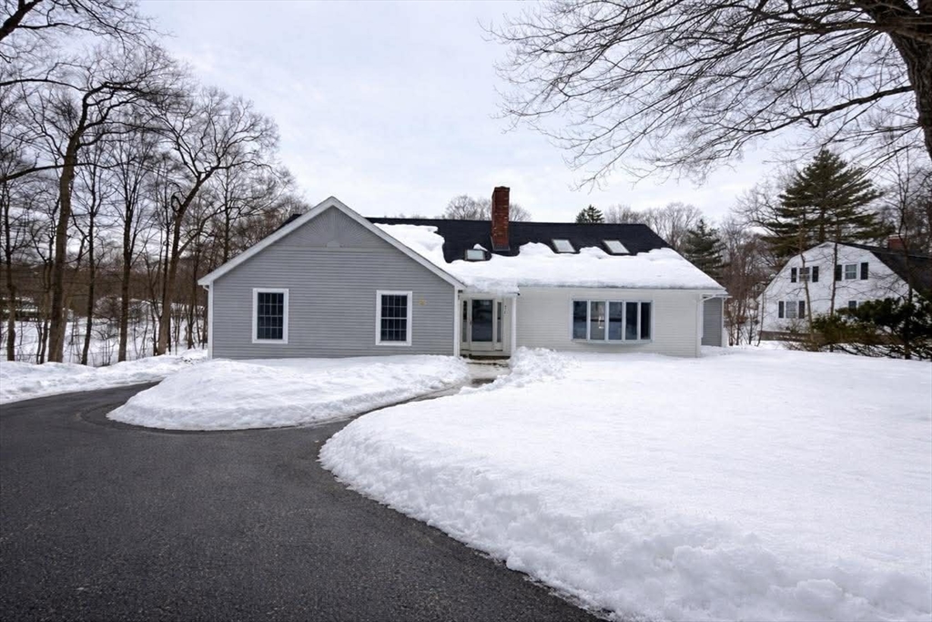 576 Grove Street Framingham, MA 01701 - Photo 4 of 38 a white house with a large tree in front of it